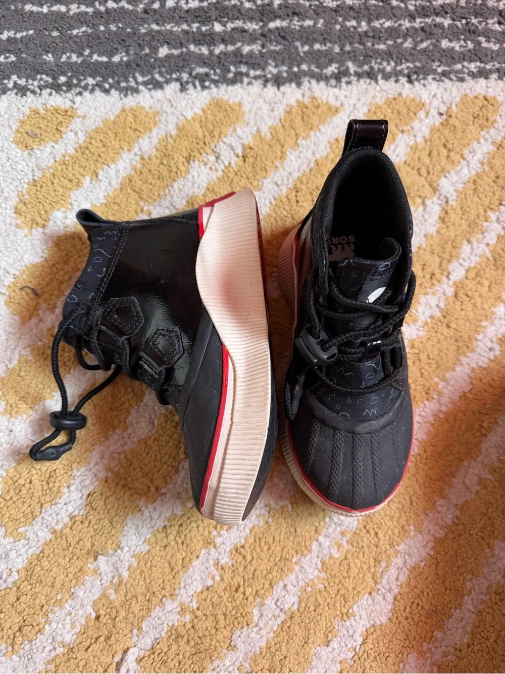 Sorel Kids Black Boots with Red Trim